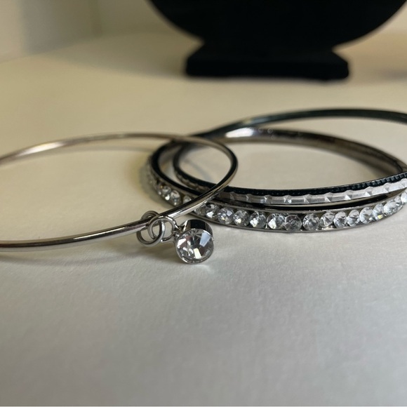 Three Elegant Silver Tone and Crystal Bangle Stacking Bracelets - Picture 5 of 6